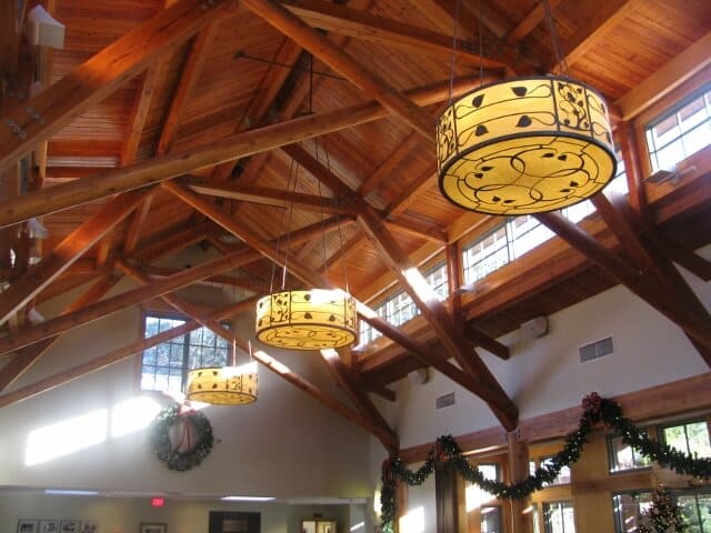 lighting fixtures hanging from a building’s high ceiling