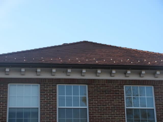 a brick home with low slope roof